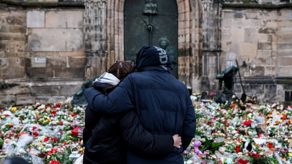 People mourn at the mourning site in front of St. John's Church following a vehicle-ramming attack in Magdeburg, Germany, Dec. 22, 2024. (EPA Photo)