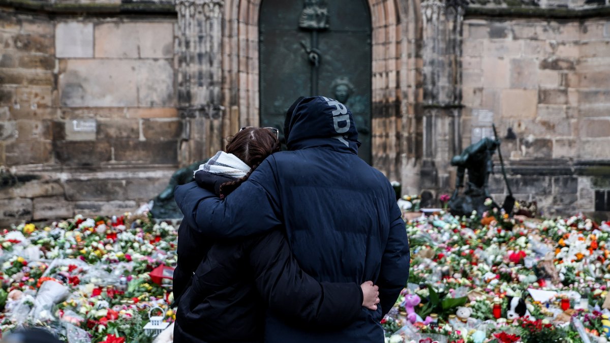 People mourn at the mourning site in front of St. John's Church following a vehicle-ramming attack in Magdeburg, Germany, Dec. 22, 2024. (EPA Photo)