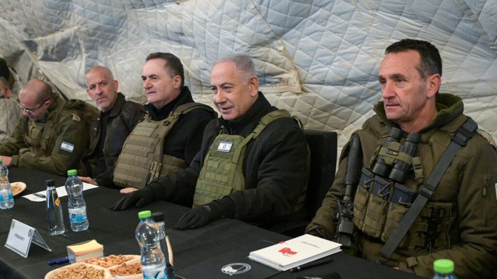Israeli Prime Minister Benjamin Netanyahu (C-R) and Defense Minister Israel Katz (C-L), sitting between army Chief-of-Staff Herzi Halevi (R) and Israel's Chief of the Mossad David Barnea (2nd L), at Mount Hermon in the annexed Golan Heights, Dec. 17, 2024. (AFP Photo - Handout)