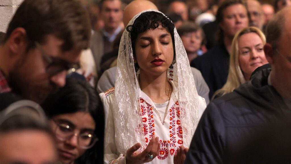 Worshippers pray during the Christmas midnight Mass at the Catholic Church of Saint Catherine, in the Nativity Church Complex, in the biblical city of Bethlehem in the occupied West Bank, Palestine, Dec. 25, 2024. (AFP Photo)