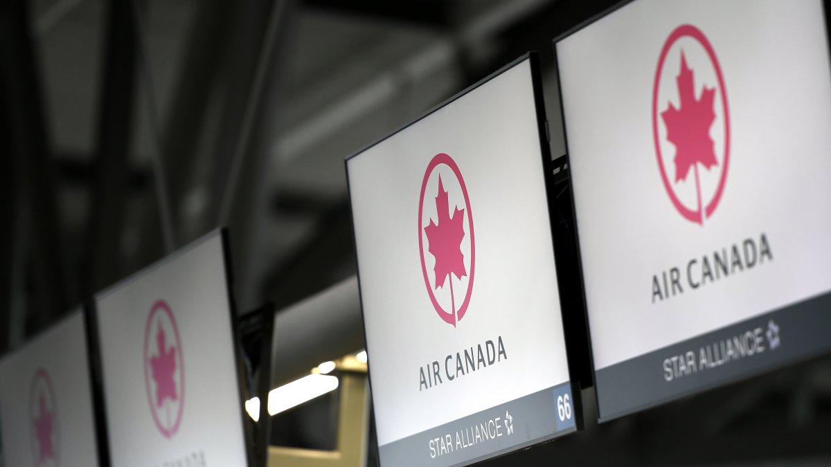 Air Canada check-in screens are seen at the Ottawa International Airport in Ottawa, Ontario, Canada, May 16, 2020. (AP Photo)