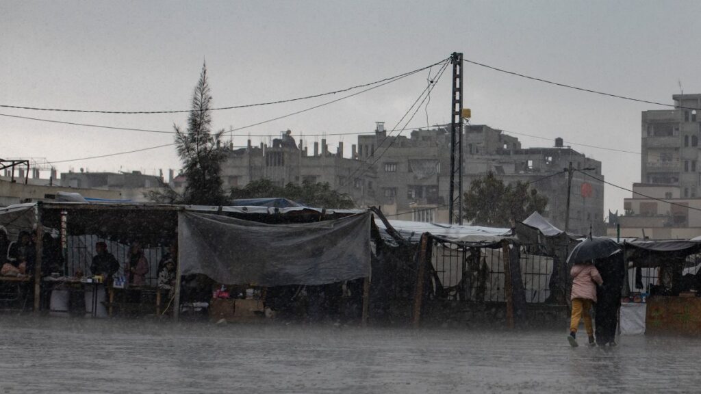 Internally displaced Palestinians check their tents, which were flooded during heavy rains in Khan Yunis, Gaza Strip, Palestine, Dec. 31, 2024. (EPA Photo)
