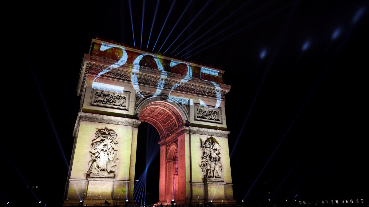 The number "2025" is projected onto The Arc de Triomphe during the New Year's celebrations on the Champs Elysees Avenue, Paris, France, Jan. 1, 2025. (Reuters Photo)