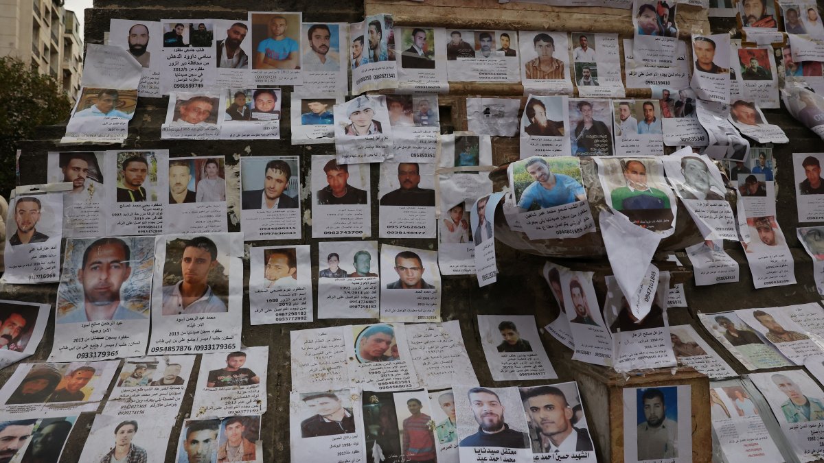 Pictures of missing people believed to be prisoners from Sednaya prison, known as a "slaughterhouse" under Bashar Assad's rule, hang in Marjeh Square, Damascus, Syria, Dec. 22, 2024. (Reuters Photo)