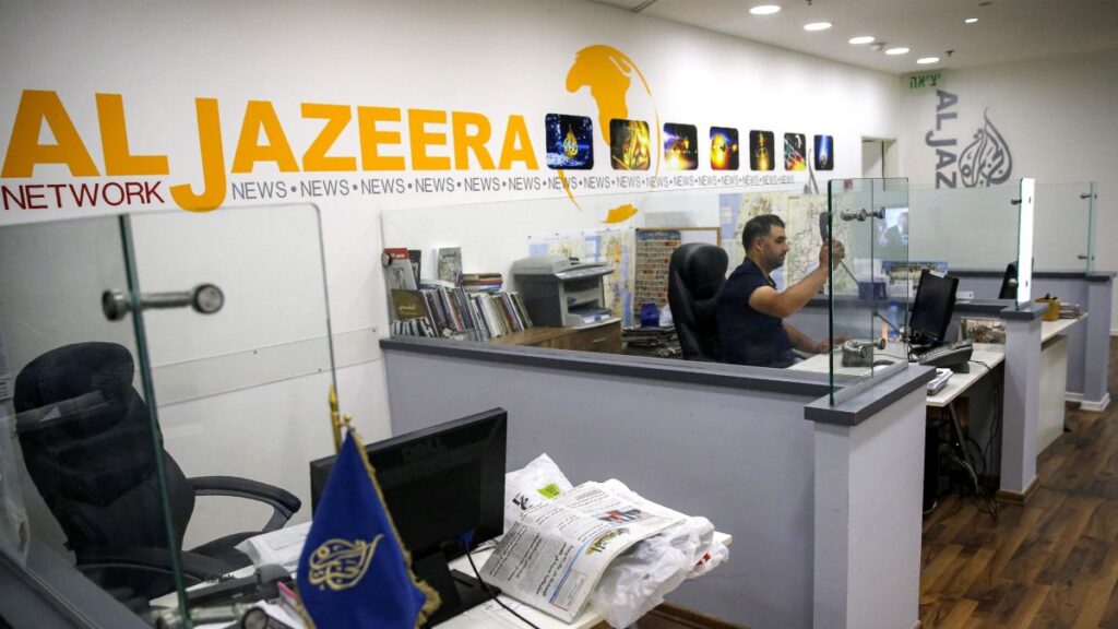 An employee of the Qatar-based news network and TV channel Al-Jazeera is seen at the channel's Jerusalem office, July 31, 2017. (AFP File Photo)