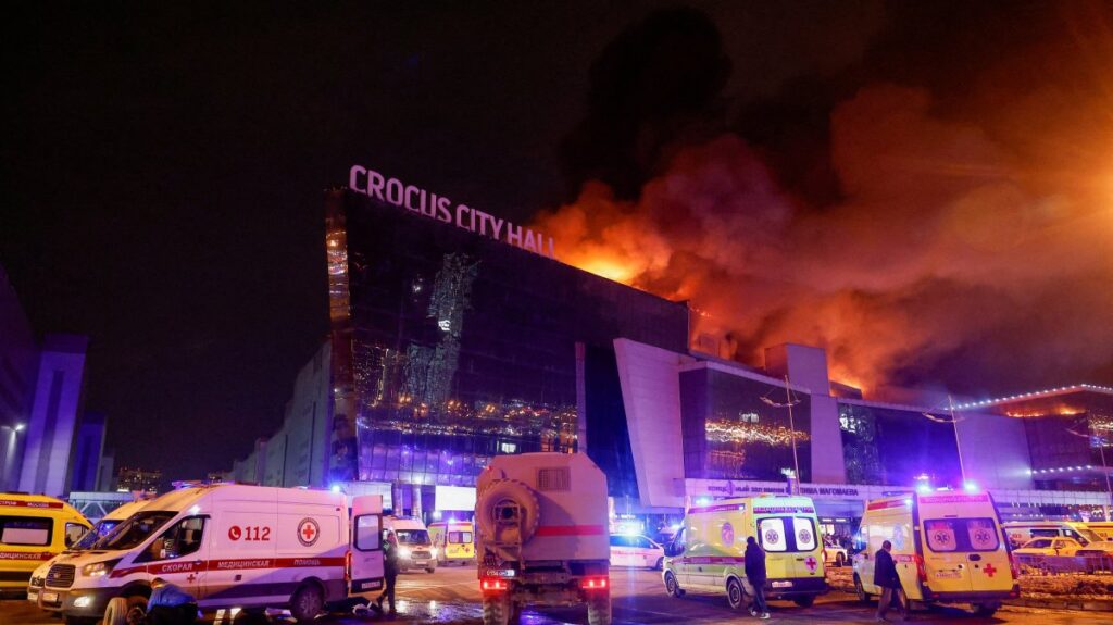 Vehicles of Russian emergency services are parked near the burning Crocus City Hall concert venue following the attack, Moscow, Russia, March 22, 2024. (Reuters Photo)