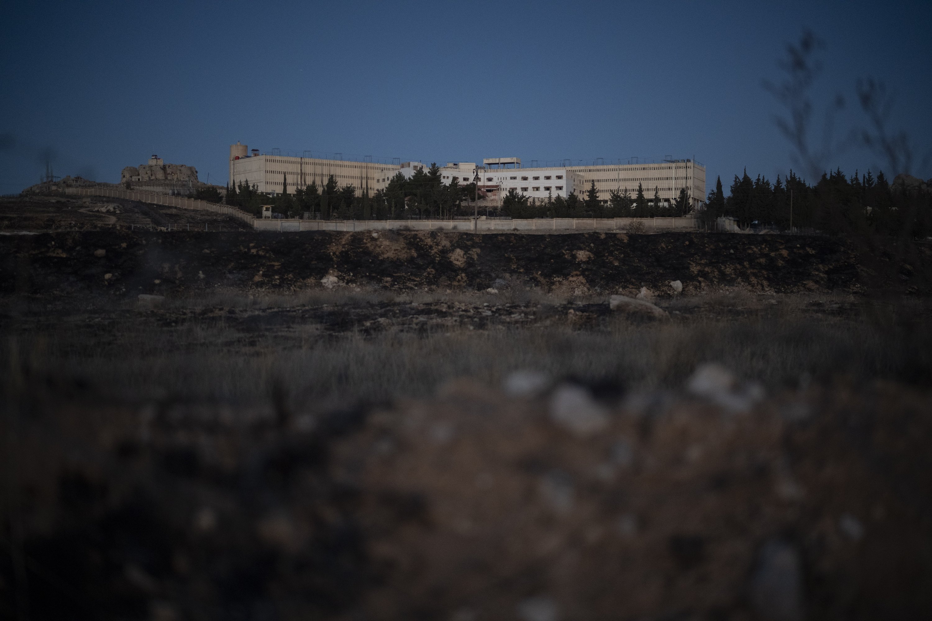 362862 The infamous Saydnaya military prison is seen during dusk, on the outskirts of Damascus, Syria, on Dec. 19, 2024. (AP Photo)