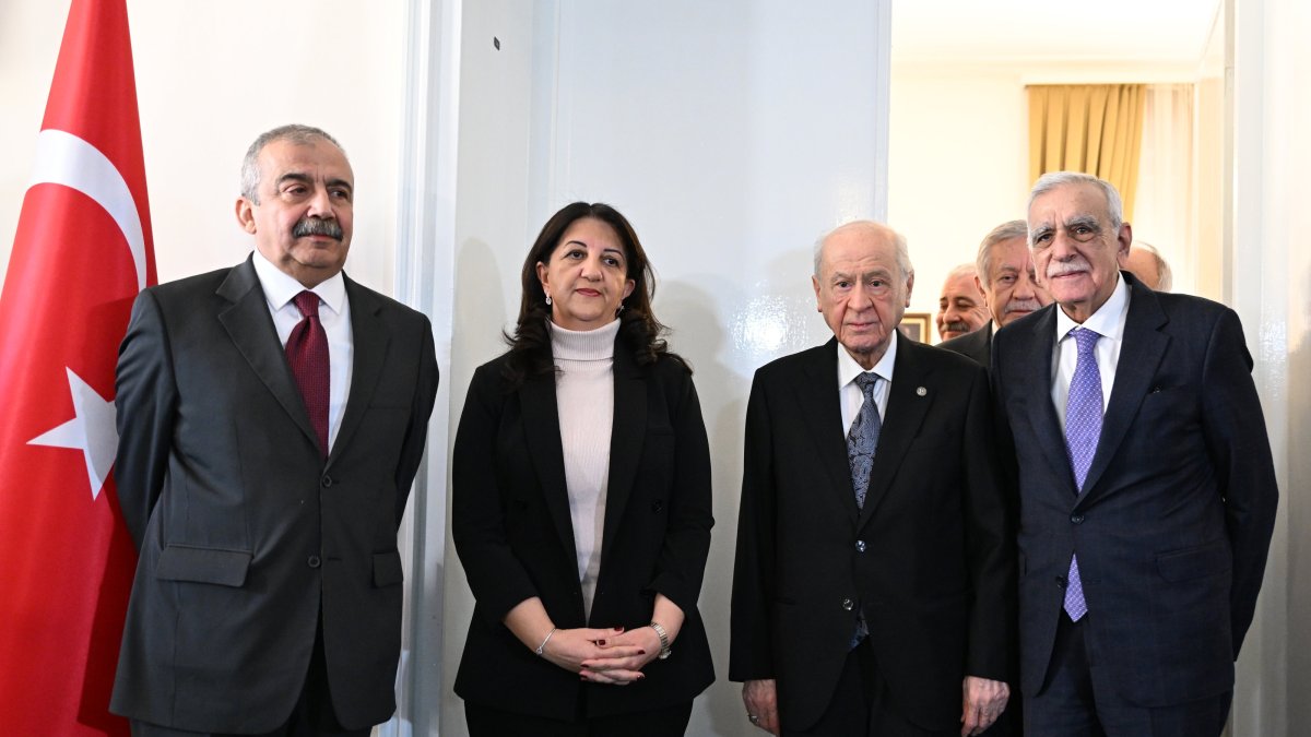 Nationalist Movement Party (MHP) leader Devlet Bahçeli (2nd R) poses ahead of a meeting with Peoples' Equality and Democracy Party (DEM Party) lawmakers Pervin Buldan (2nd L), Sırrı Süreyya Önder (L) and Ahmet Türk (R) at Parliament, Ankara, Türkiye, Jan. 2, 2024. (AA Photo)