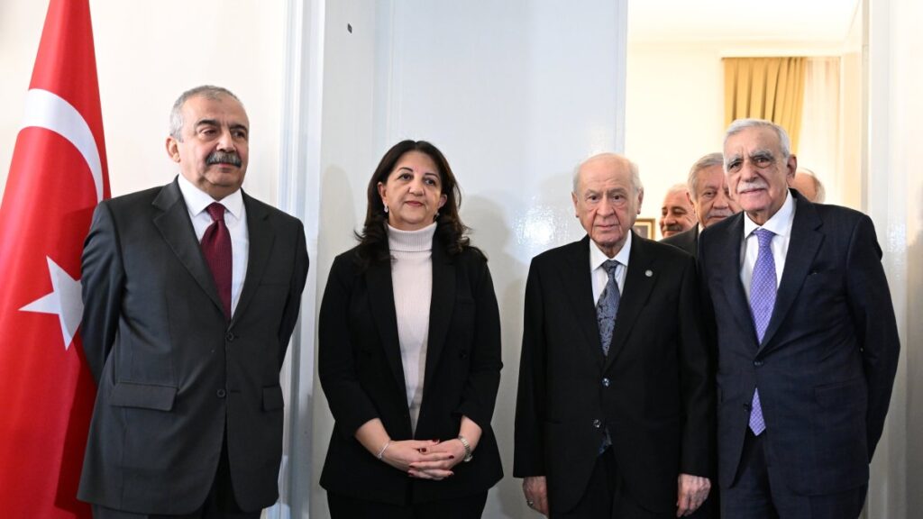 Nationalist Movement Party (MHP) leader Devlet Bahçeli (2nd R) poses ahead of a meeting with Peoples' Equality and Democracy Party (DEM Party) lawmakers Pervin Buldan (2nd L), Sırrı Süreyya Önder (L) and Ahmet Türk (R) at Parliament, Ankara, Türkiye, Jan. 2, 2024. (AA Photo)