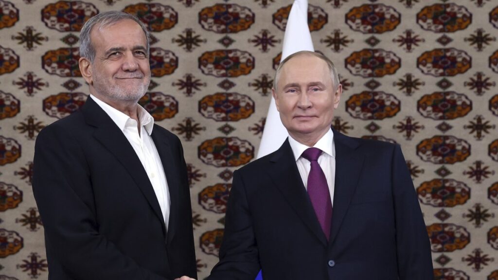 Russian President Vladimir Putin (R) and Iranian President Masoud Pezeshkian shake hands in Ashgabat, Turkmenistan, Oct. 11, 2024. (AP Photo)