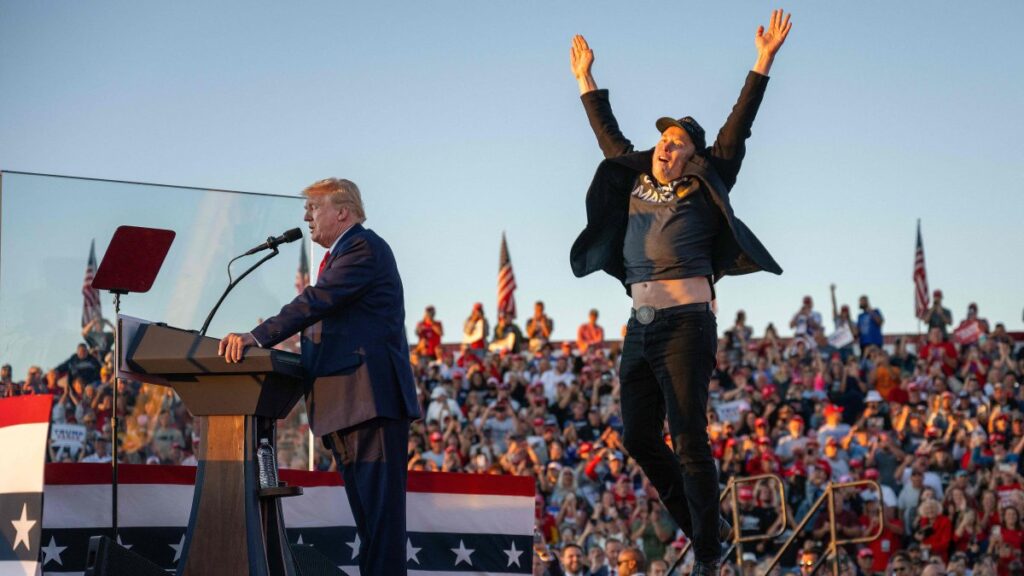 Tesla CEO Elon Musk (R) jumps on stage as he joins former U.S. President and Republican presidential candidate Donald Trump during a campaign rally at the site of his first assassination attempt in Butler, Pennsylvania, U.S., Oct. 5, 2024. (AFP Photo)