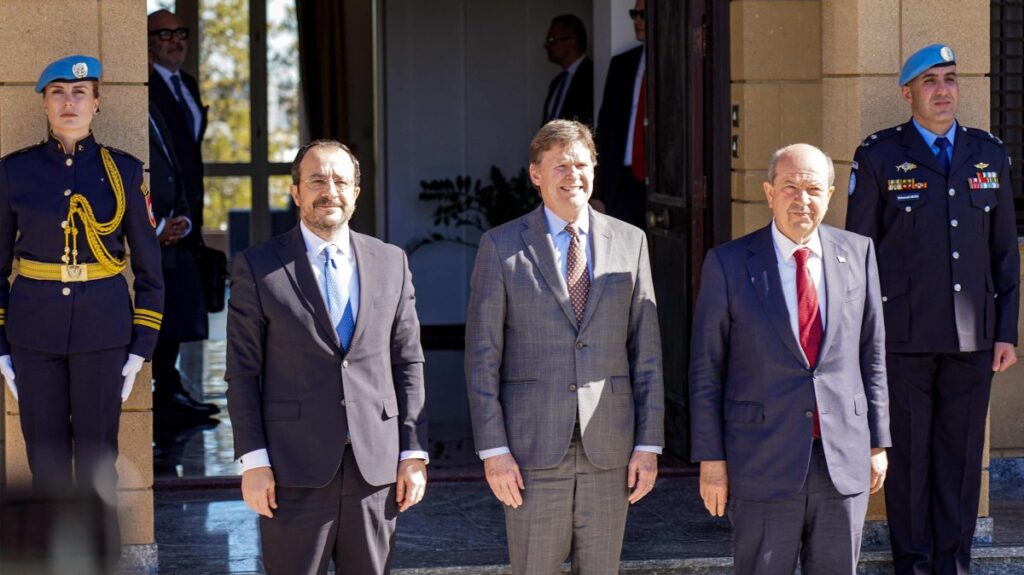 Colin Stewart (C), the U.N. Secretary-General's Special Representative in Cyprus, hosts Greek Cypriot leader Nicos Anastasiades (L) and Turkish-Cypriot leader Ersin Tatar (R) for a meeting to discuss the opening of new crossing points in the U.N. buffer zone dividing Cyprus' capital Nicosia, Jan. 20, 2025. (AFP Photo)