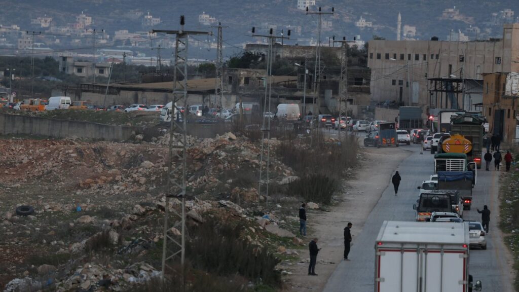 Palestinians in their vehicles wait in line to cross the Israeli army checkpoint of Bet Forik at the entrance of Nablus, West Bank, Jan. 21, 2025. (EPA Photo)