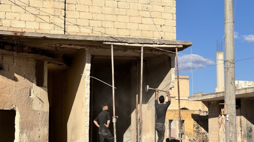 People repair a damaged building in Tal Rifaat, Syria, Jan. 21, 2025. (AA Photo)
