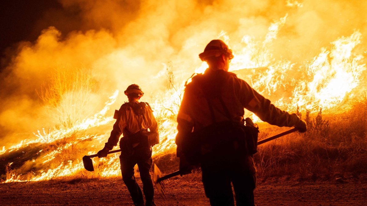 Firefighters work as the Hughes Fire burns in Castaic, California, U.S., Jan. 22, 2025. (AFP Photo)