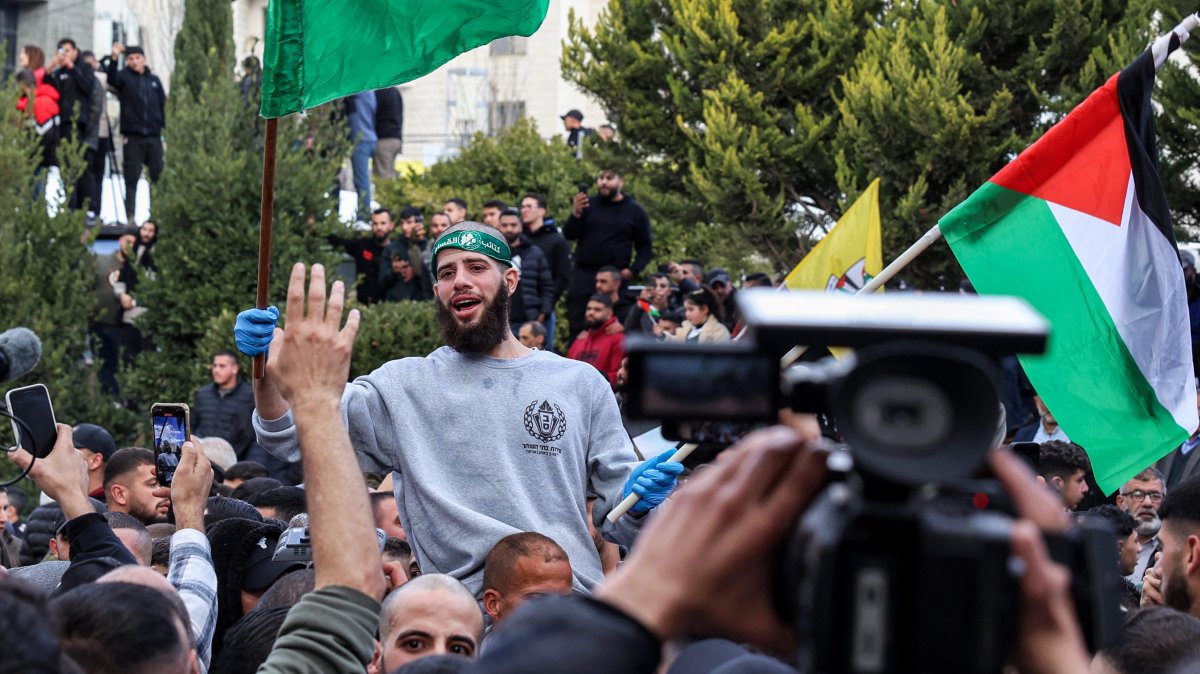 A Palestinian prisoners released by Israel reacts while being carried on people's shoulders in Ramallah, occupied West Bank, Jan. 25, 2025. (AFP Photo)