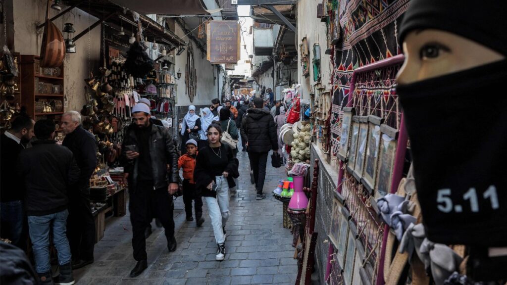People walk along a market alley in the old city of Damascus, Syria, Jan. 18, 2025. (AFP Photo)