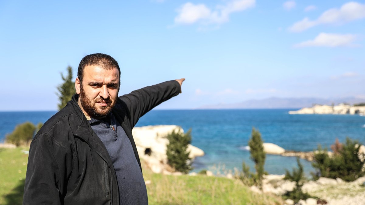 Ibrahim Bilal from a Silayip Turkmen village points at a strip of land with palaces belonging to the ousted Assad regime, Latakia, Syria, Jan. 16, 2025. (AA Photo)