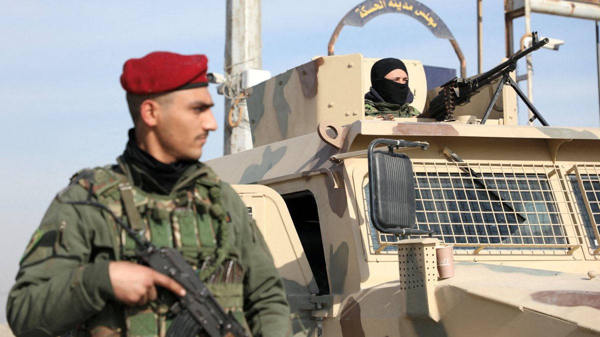 A member of the PKK/YPG terrorist group stands near a street after anti-regime forces seized the capital and ousted Bashar Assad, Hassakeh, Syria, Dec. 11, 2024. (Reuters Photo)