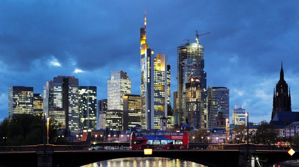 A double-decker bus passes the skyline with its dominating banking district in Frankfurt, Germany, Nov. 8, 2023. (Reuters Photo)