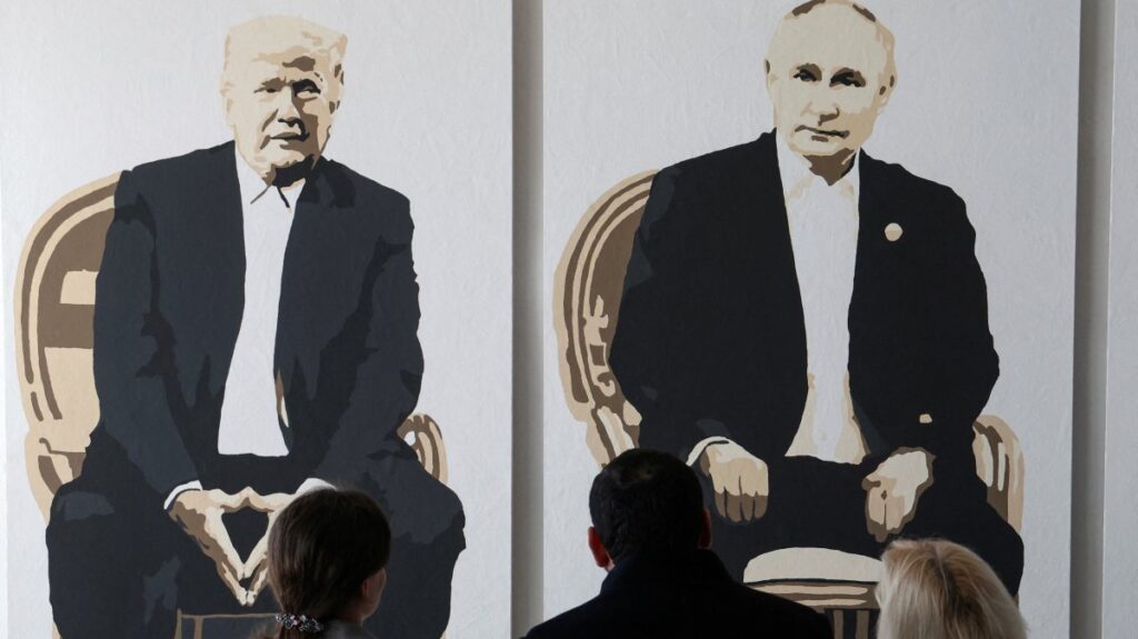 Visitors stand in front of an artwork depicting U.S. President Donald Trump and Russian President Vladimir Putin at an exhibition, in Yalta, Crimea, Feb. 8, 2025. (Reuters Photo)