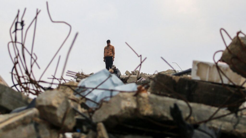 A Palestinian man stands on the rubble of a destroyed building on Salah al-Din road in al-Mughraqa in the central Gaza Strip, Palestine, Feb. 10, 2025. (AFP Photo)