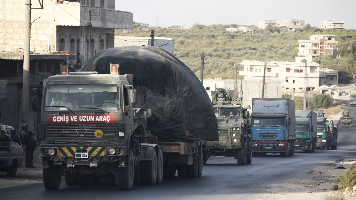 A Turkish military convoy drives through the village of Urum al-Jawz, in Idlib province, Syria, Oct. 20, 2020. (AP Photo)
