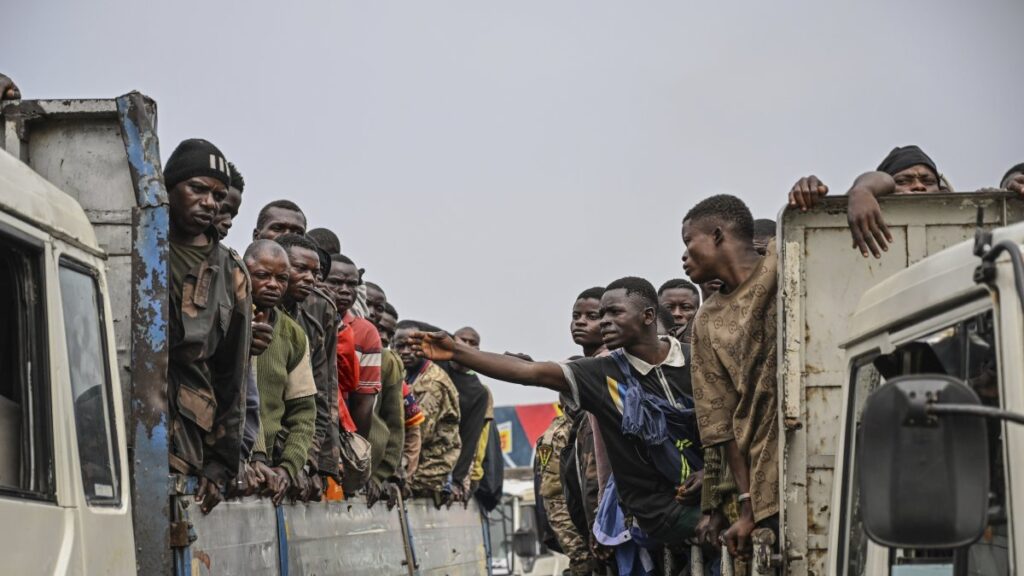 M23 rebels escort government soldiers and police who surrendered to an undisclosed location, Goma, DRC, Jan. 30, 2025. (AP Photo)