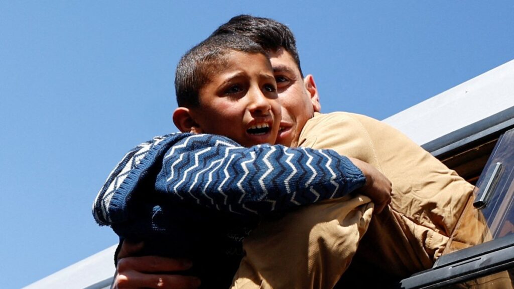 A freed Palestinian prisoner is hugged by a boy after being released by Israel as part of a hostages-prisoners swap between Hamas and Israel, in Khan Younis, in the southern Gaza Strip, Palestine, Feb. 15, 2025. (Reuters Photo)