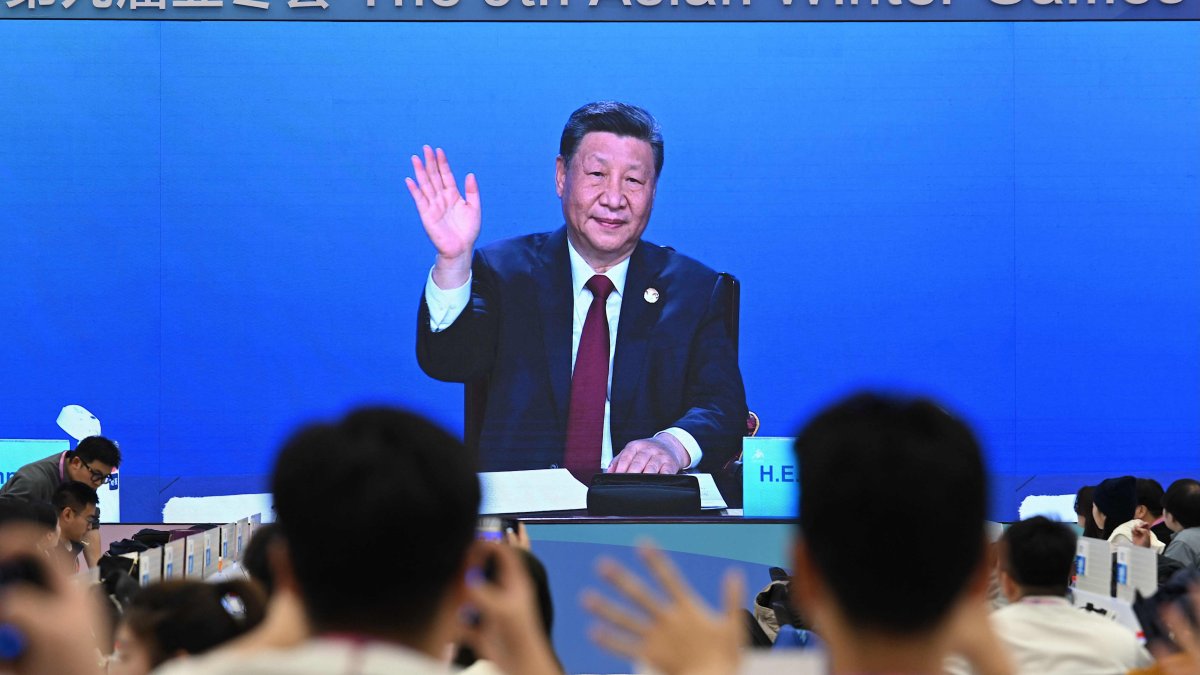 A screen at a media center shows China's President Xi Jinping attending the opening ceremony of the Harbin 2025 Asian Winter Games, Harbin, Heilongjiang province, China, Jan. 7, 2025. (AFP Photo)
