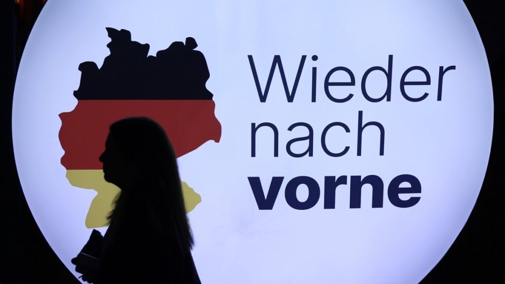 A person passes the slogan "Forward again" during a Christian Democratic Union (CDU) party election campaign event, Sankt Ingbert, Germany, Feb. 6, 2025. (EPA Photo)