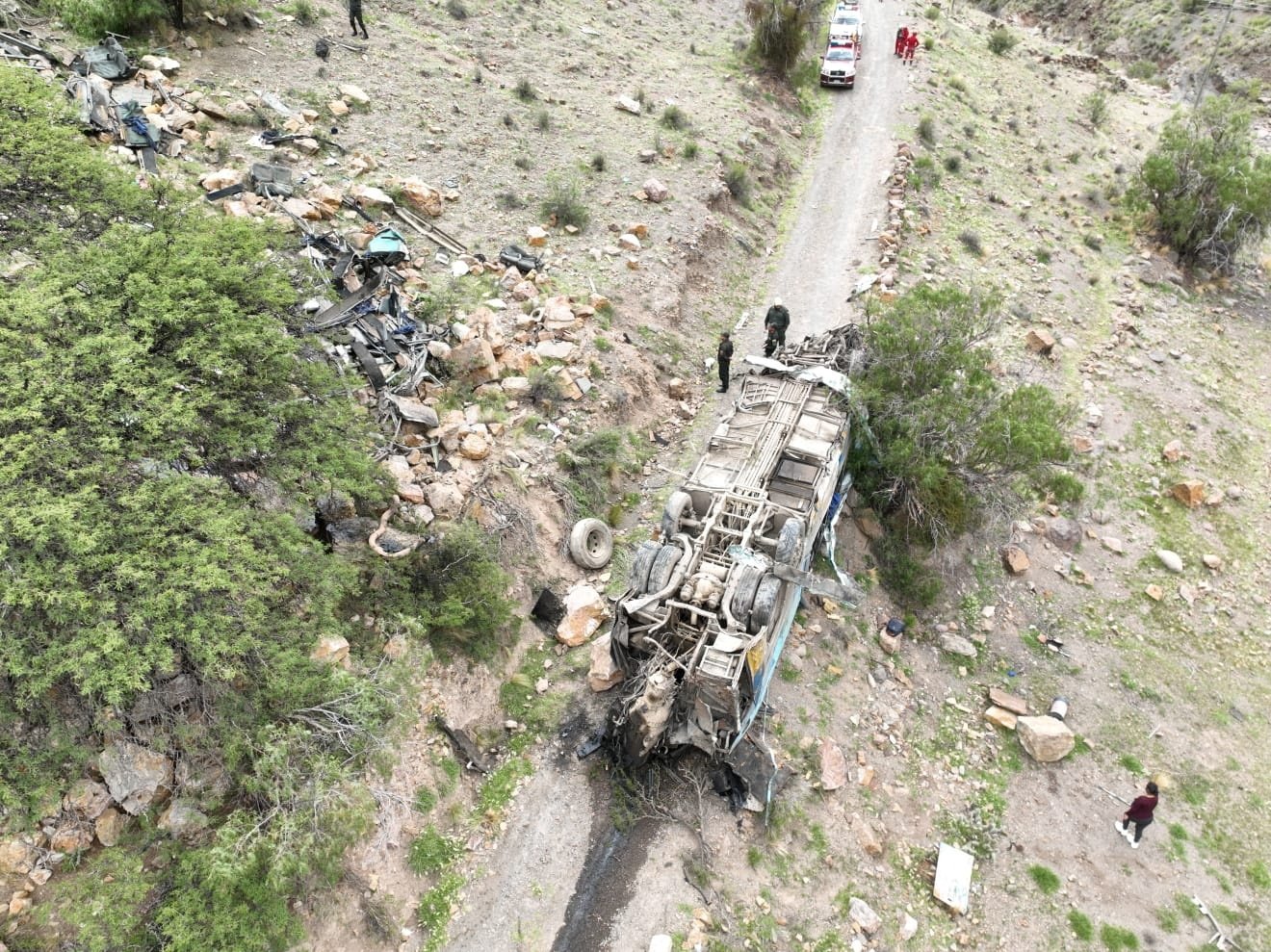 Emergency personnel respond to the scene of a deadly crash after a bus dropped off a precipice, Yocalla, Bolivia, Feb. 17, 2025. (Reuters Photo)