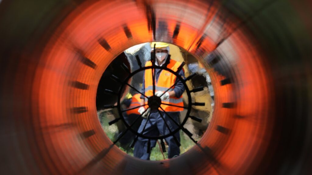 Workers are seen through a pipe at a construction site on the extension of Russia's TurkStream gas pipeline in Letnitsa, Bulgaria, June 1, 2020. (Reuters Photo)