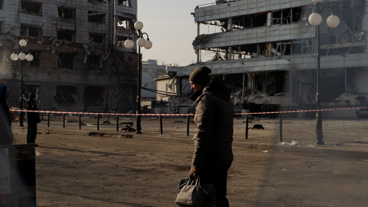 A man walks next to damaged buildings following a missile attack, Kyiv, Ukraine, Feb. 12, 2025. (AFP Photo)
