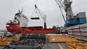 Workers move a cargo of aluminum blocks at a commercial port in Vladivostok, Russia, April 6, 2023. (Reuters Photo)
