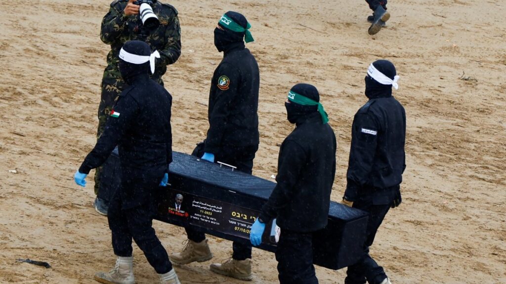 Hamas members carry a coffin carrying the body of an Israeli captive, before being handed over to the Red Cross, in Khan Younis, southern Gaza Strip, Feb. 20, 2025. (Reuters Photo)