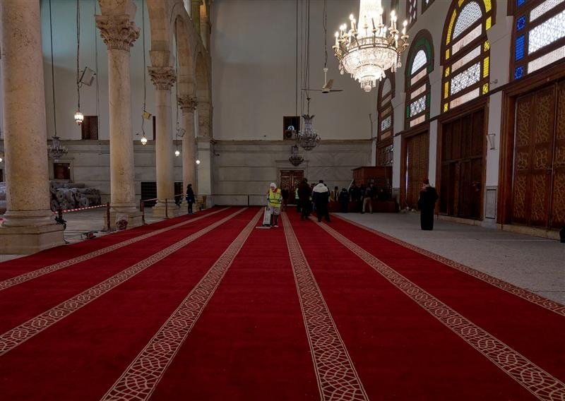 The interior of the Umayyad Mosque, showcasing the newly laid burgundy-colored wool carpets, Damascus, Syria,  Feb. 22, 2025. (AA Photo)