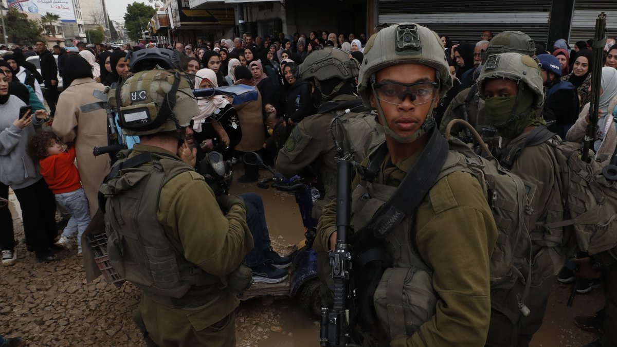 Israeli soldiers prevent Palestinians from returning to their homes at the Jenin refugee camp during an ongoing military operation in Jenin, occupied West Bank, Palestine, Feb. 19, 2025. (EPA Photo)