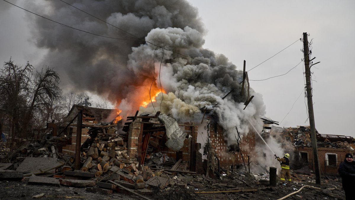 Ukrainian rescuers work at the site of a rocket attack on a building, Kharkiv, northeastern Ukraine, Jan. 23, 2024. (EPA Photo)
