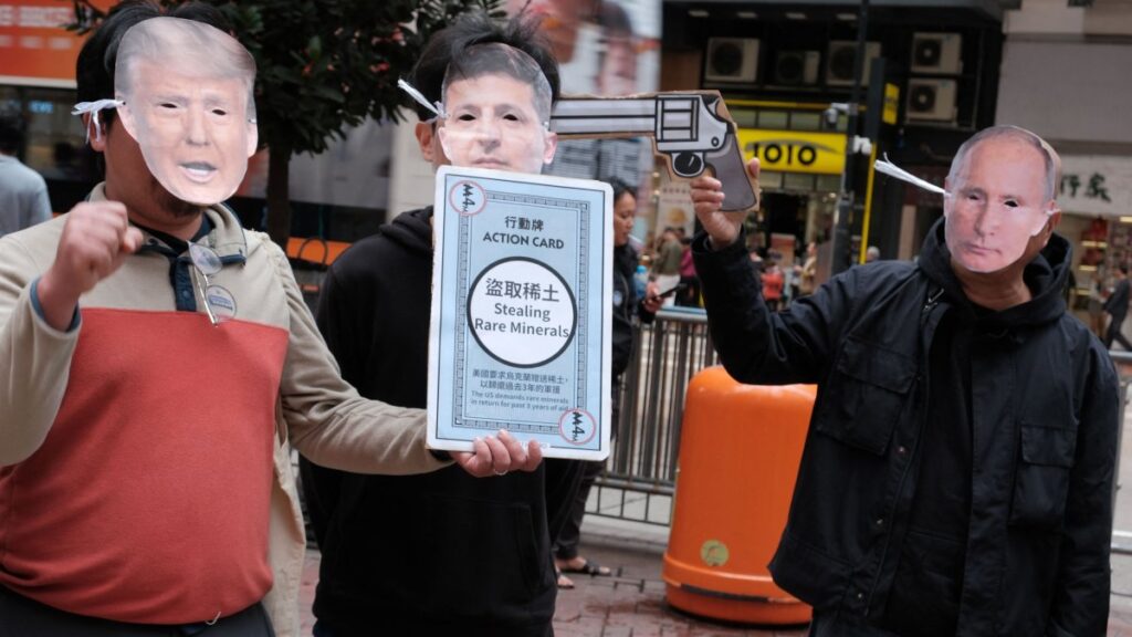 (From L-R) Activists wearing masks of U.S. President Donald Trump, Ukrainian President Volodymyr Zelenskyy and Vladimir Putin take part in a demonstration in Hong Kong, Feb. 23, 2025. (AFP Photo)
