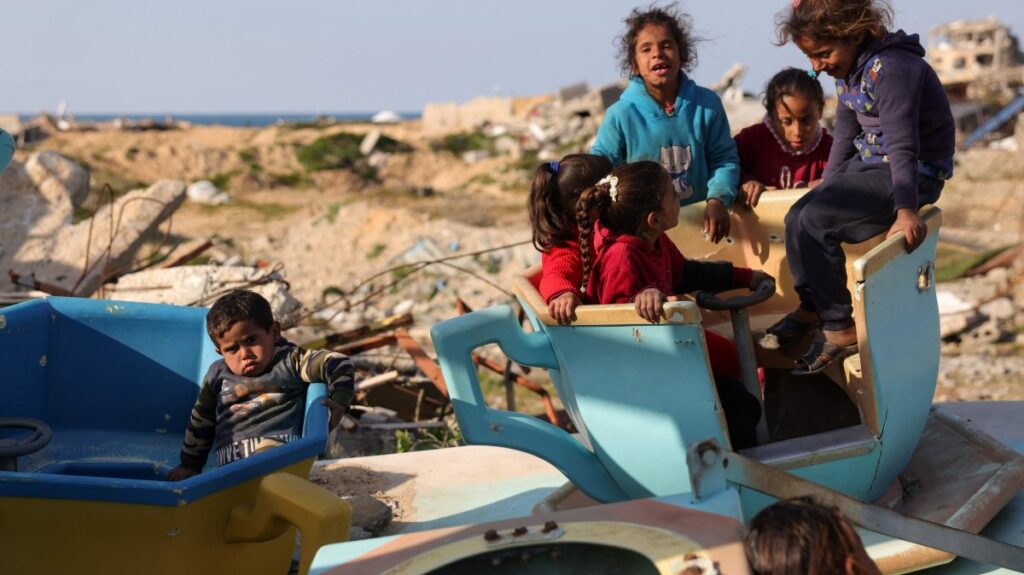 Palestinian children play in a war-damaged merry-go-round at the destroyed children's park west of Jabalia, northern Gaza Strip, Palestine, Feb. 26, 2025. (AFP Photo)