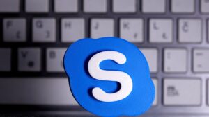 A 3D-printed Skype logo is placed in front of a keyboard in this illustration taken on April 12, 2020. (Reuters Photo)