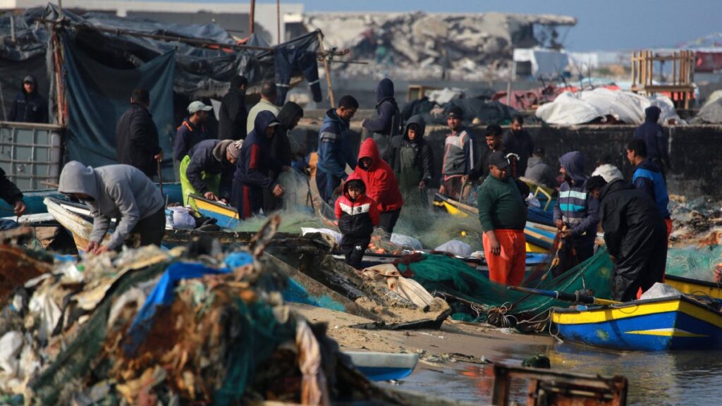Palestinians gather with fishermen at the port of Gaza City, Palestine, March 9, 2025. (AFP Photo)