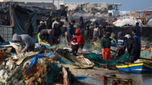 Palestinians gather with fishermen at the port of Gaza City, Palestine, March 9, 2025. (AFP Photo)
