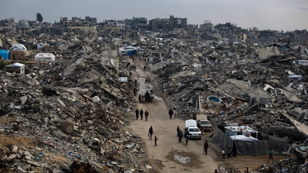 Palestinians walk among the rubble of their destroyed homes during the month of Ramadan, in the city of Beit Lahia, northern Gaza Strip, March 9, 2025.  (EPA Photo)