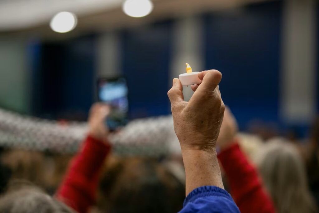 A mourner holds a candle at a vigil service for Wadea al-Fayoume, 6, a Muslim boy who was stabbed to death in an attack that targeted him and his mother for their religion and as a response to the Israel-Hamas war, in Plainfield, Illinois, U.S., Oct. 17, 2024. (Reuters Photo)