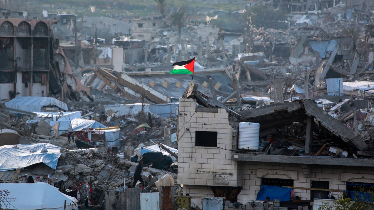 A Palestinian flag flutters amid the ruins of buildings in Beit Lahia in the northern Gaza Strip, Gaza, Palestine, March 4, 2025. (AFP Photo)