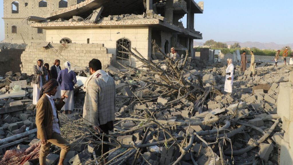 People stand on the rubble of a house hit by a U.S. strike in Saada, Yemen, March 16, 2025. (Reuters Photo)
