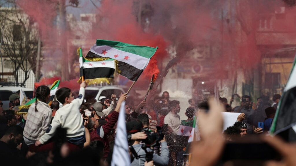 People gather during a demonstration marking the 14th anniversary of the start of the Syrian conflict, Idlib, Syria, March 15, 2025. (Reuters Photo)