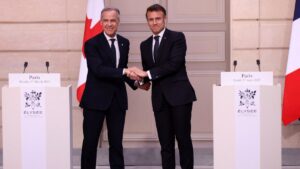 French President Emmanuel Macron (R) and Canadian Prime Minister Mark Carney shake hands after a joint statement, at Elysee Palace, during Carney's first foreign visit as prime minister, Paris, France, March 17, 2025. (Reuters Photo)